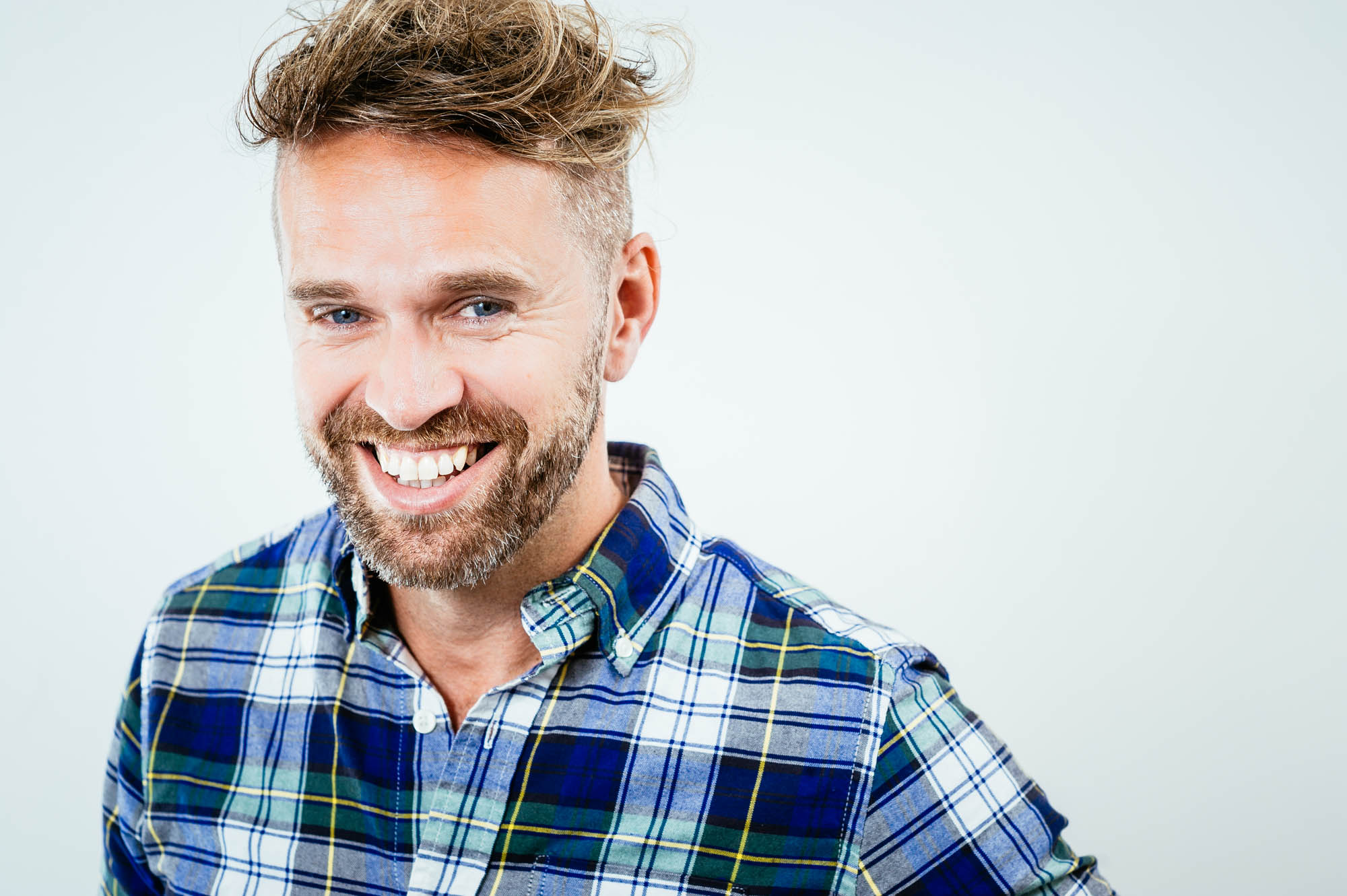 A headshot of a male actor